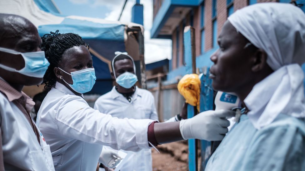 A team from Shining Hope for Communities providing services and support during the Covid-19 pandemic (Credit: Yasuyoshi Chiba/Getty Images)