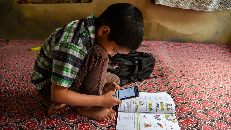During the pandemic, mobile phones provided a crucial way for children to access online classes while at home (Credit: Idrees Abbas/Getty Images)