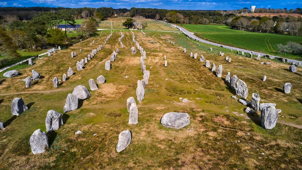 The Carnac Alignments consist of more than 3,000 hand-carved stones called menhirs (Credit: Tuul & Bruno Morandi/Getty Images)