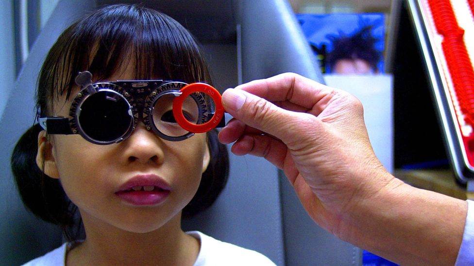 A child in Singapore has her eyesight tested (Credit: Getty Images)