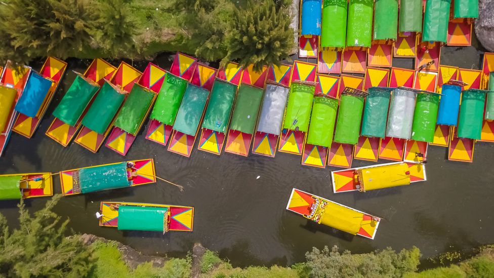 On weekends, the canals of Xochimilco are packed with colourful trajineras carrying crowds of tourists (Credit: Gianfranco Vivi/Getty Images)