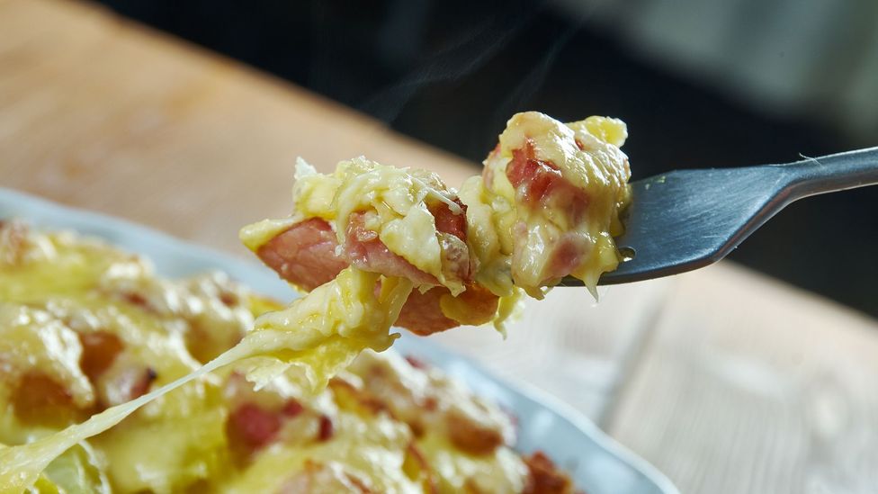The context for your enjoyment of comfort food – such as this unctuous tartiflette – may matter more than anything else (Credit: Alezander Mychko/Getty Images)