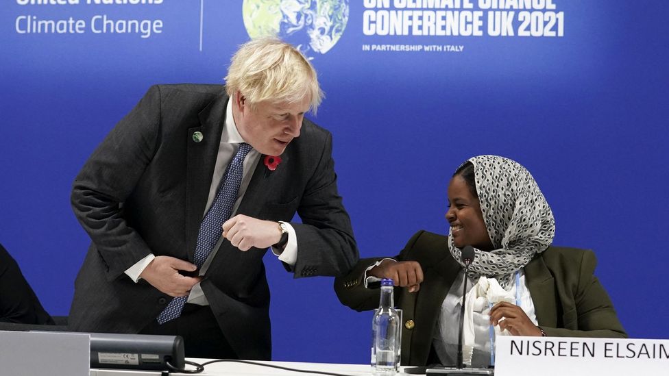 Nisreen Elsaim, pictured here with Boris Johnson at Cop26, says young people are often given less floor time than other speakers at events (Credit: Kevin Lamarque/Getty Images) Nisreen Elsaim, pictured here with Boris Johnson at Cop26, says young people are often given less floor time than other speakers at events (Credit: Kevin Lamarque/Getty Images)