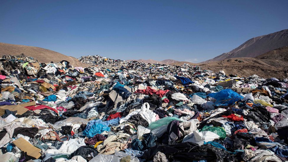 Many clothes end up in landfill sites, where they decompose and release potent greenhouse gases (Credit: Antonio Cossio / Alamy)