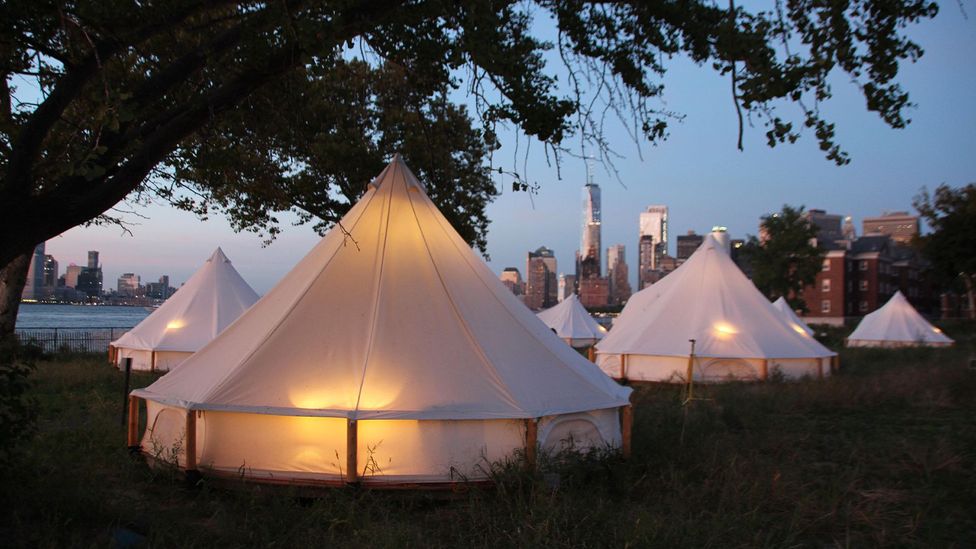 Travellers to New York can now glamp on Governors Island with views of the Statue of Liberty and the Manhattan skyline (Credit: dpa picture alliance/Alamy)