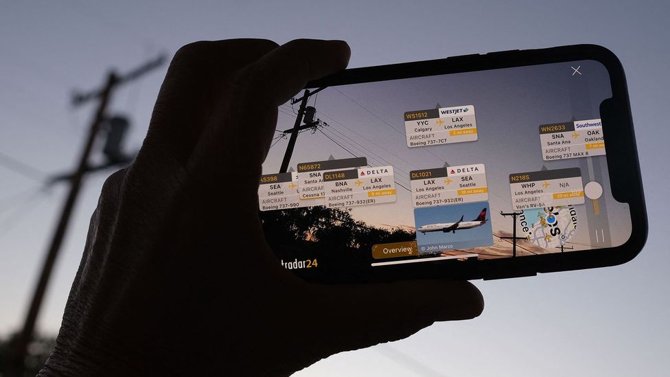 Smartphones have enabled the digital and real worlds to be blended through augmented reality, allowing users to track aircraft overhead, for example (Credit: Getty Images)