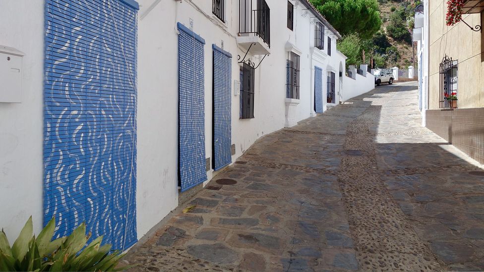 The artist José Medina Galeote painted façades in Genalguacil, Malaga after consulting with the local community (Credit: José Medina Galeote)