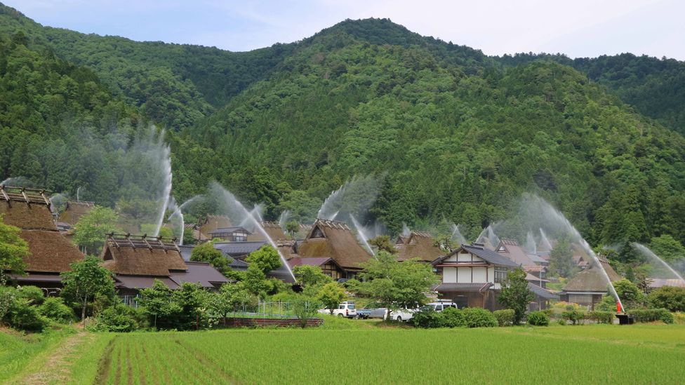 Kayabuki no Sato's fire suppression system is tested twice a year during the Water Hose Festival (Credit: Kyoto Miyama Tourism Association)