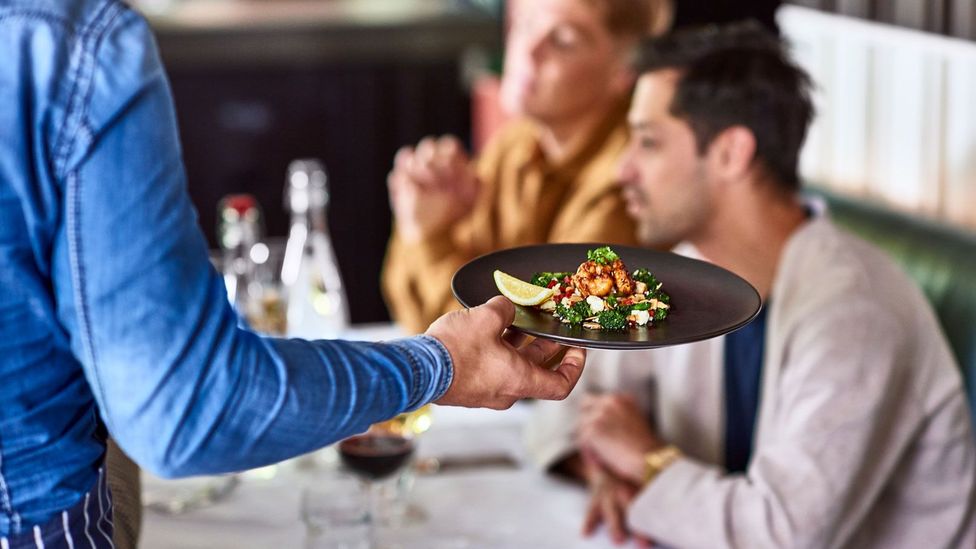 While these high earners take trips with friends several times a year, frequently eat at restaurants, and put money into savings, it never feels like enough (Credit: Getty Images)