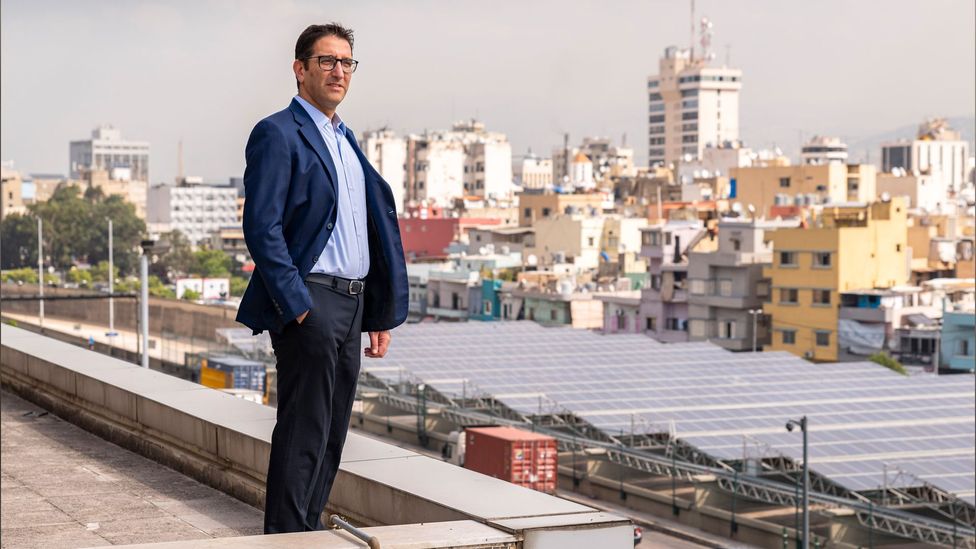 Pierre El-Khoury stands on the roof of the Ministry of Energy and Water overlooking his Beirut river solar snake project (Credit: Patrick Gaillardin)