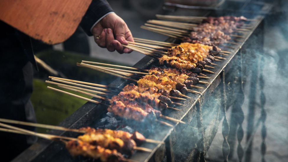 Xinjiang-style barbecue consists of grilled lamb meat flavoured with cumin and chilli (Credit: Xia Yuan/Getty Images)