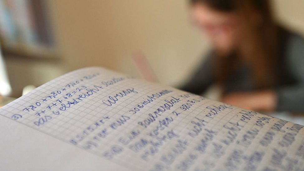 A schoolgirl in Germany does her maths homework (Credit: Getty Images)
