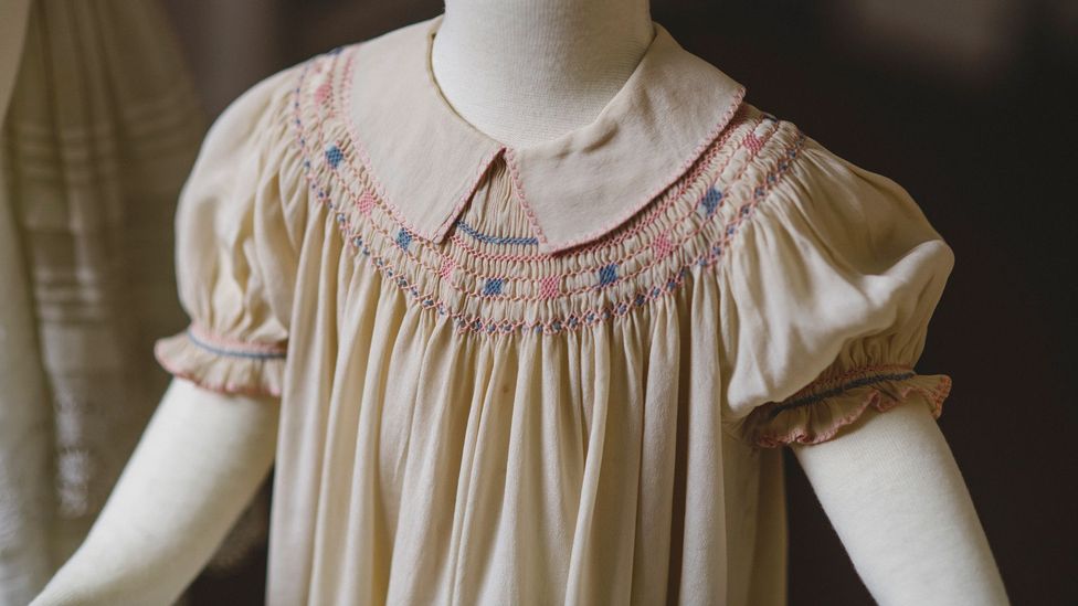 Smocking, seen here on a child's dress from around 1885-90, means that clothing can expand as the wearer grows (Credit: National Trust/ Steve Haywood)