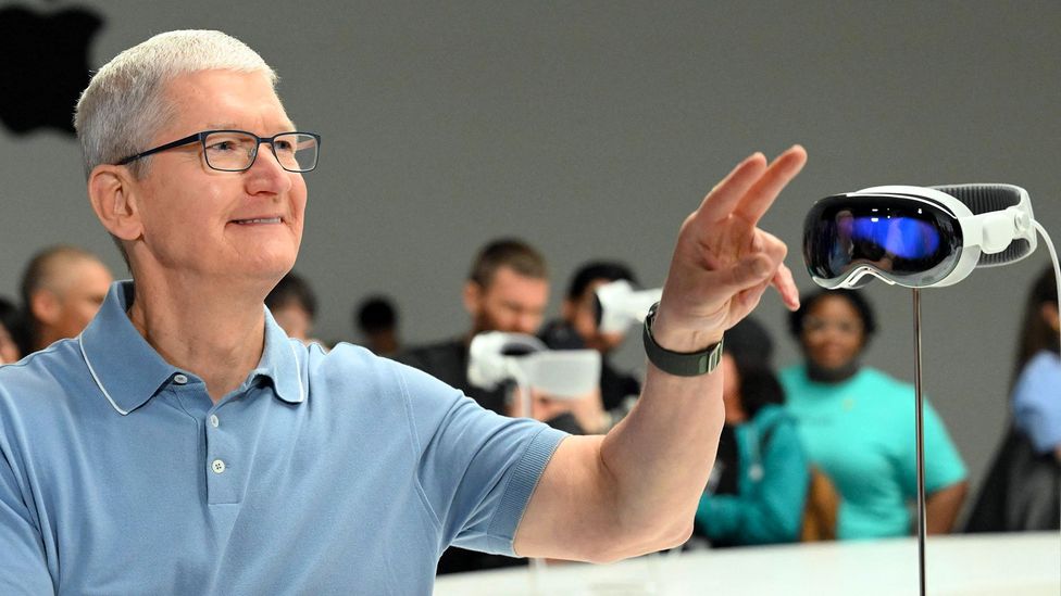 Apple CEO Tim Cook gestures at the Apple Vision Pro (Credit: Getty Images)