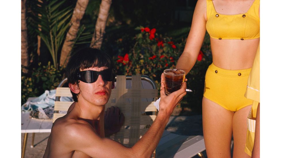 George Harrison photographed relaxing in Miami, February 1964, during the band's US tour (Credit: Paul McCartney)