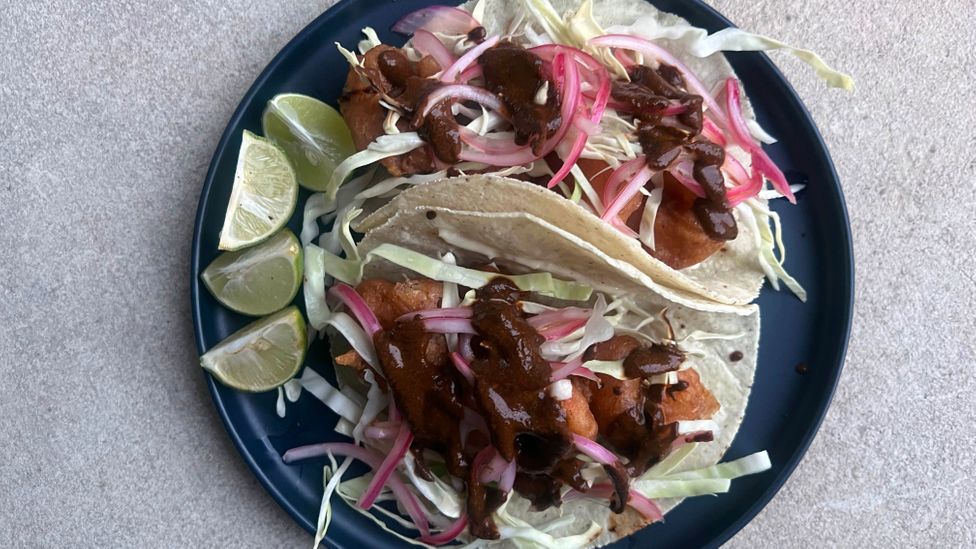 These Sonoran-style tacos are filled with crispy shrimp, nutty salsa and pickled onions (Credit: Jed Portman)
