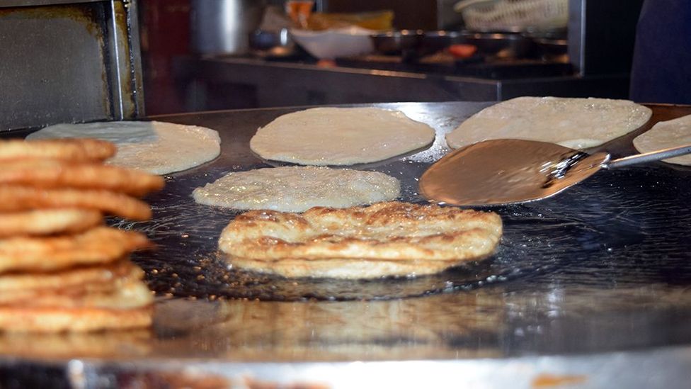 Paratha is fried until flaky and crisp (Credit: Aysha Imtiaz)