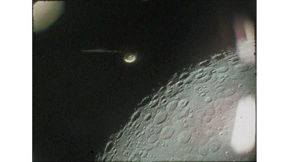 Original footage of the Apollo 16 expedition features a mystery object next to the moon. It looks alien – but turned out to be a floodlight on the launch vehicle (Credit: Nasa)