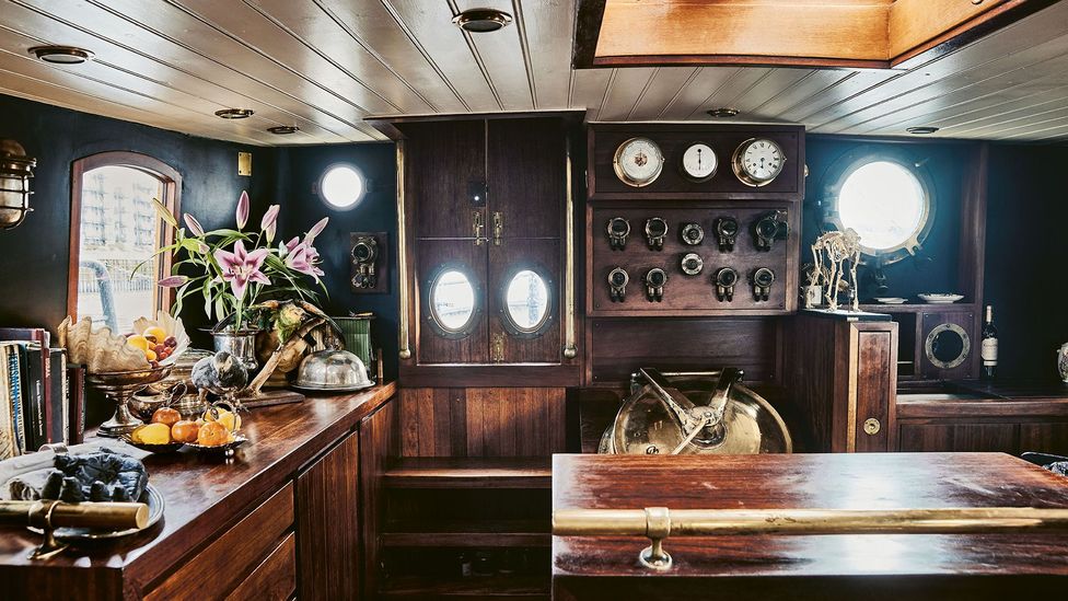 The interior of De Walvisch has been renovated with reclaimed wood – the sailing clipper is moored in East London (Credit: Roger Bool)