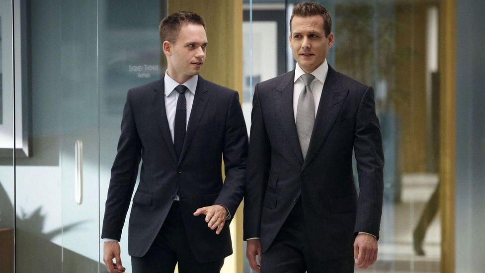 Suits follows Mike Ross (Patrick J Adams) and Harvey Specter (Gabriel Macht), as they try to win cases while hiding Mike's secret (Credit: Alamy)