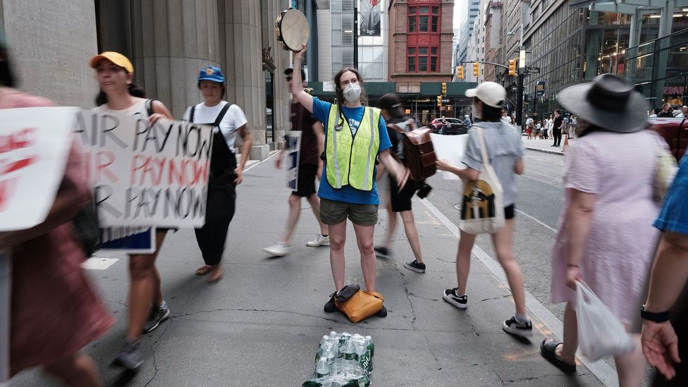 Young workers strike at the Manhattan headquarters of publisher HarperCollins in July 2022 (Credit: Getty Images)