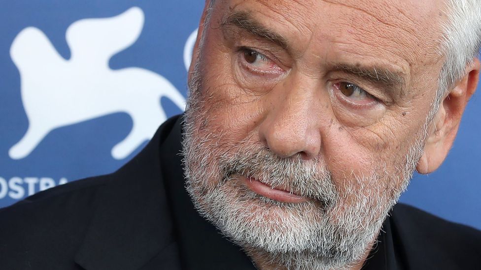Luc Besson attends a photocall at the Venice Film Festival, where his film Dogman was shown (Credit: Getty Images)