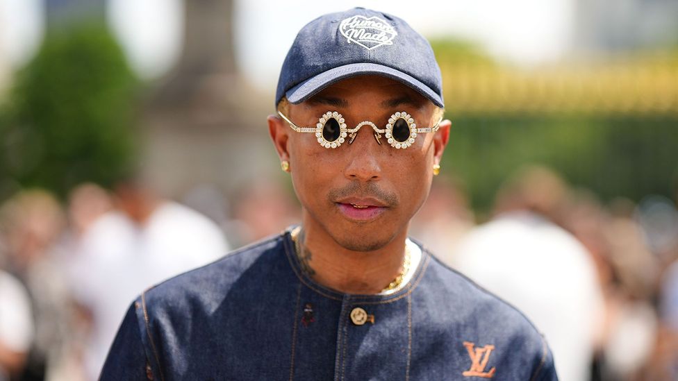 Pharrell Williams wearing quirky sunglasses and cap