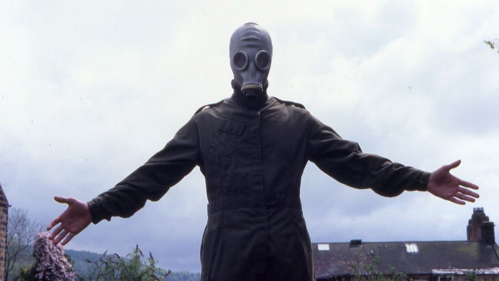 Paddy Considine's Richard wears a gas mask to sinister effect – something the actor came up with via improvisation (Credit: Warp films)