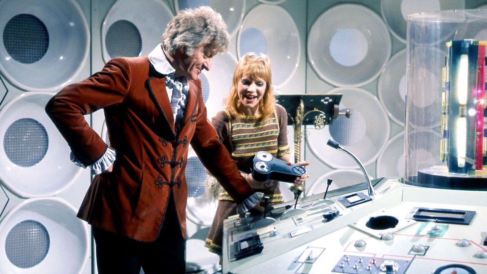 Jon Pertwee in velvet jacket as Dr Who with assistant in the Tardis