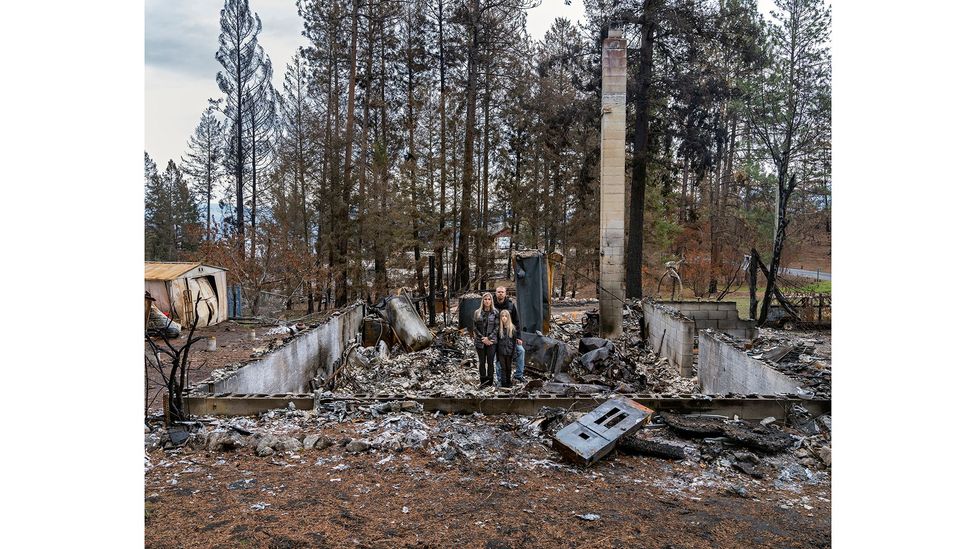 Rhonda Rossbach, Derek Briem and Autumn Briem, Killiney Beach, British Columbia, Canada, 16 October 2021, from the series Burning World (Credit: Gideon Mendel)