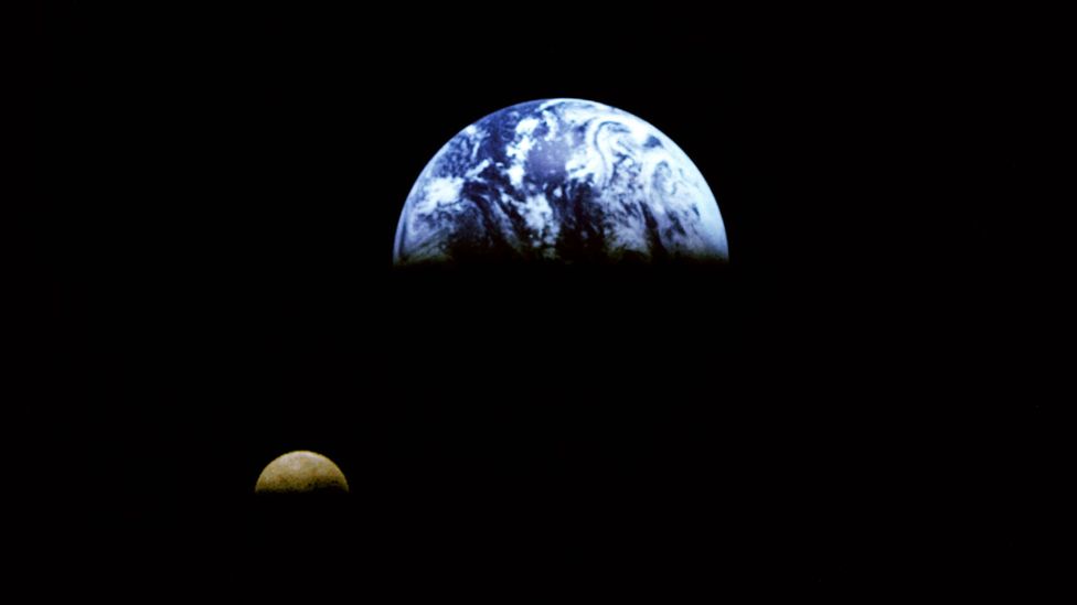A view of the Moon orbiting the Earth taken from 3.9 million miles away by the Galileo spacecraft (Credit: Nasa/JSC)