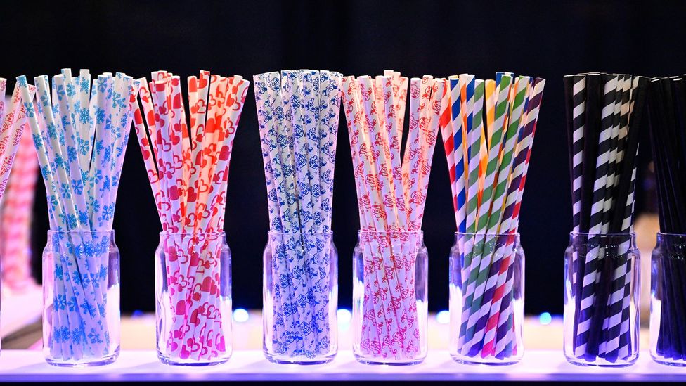 A selection of multi-coloured straws in jars (Credit: Getty Images)