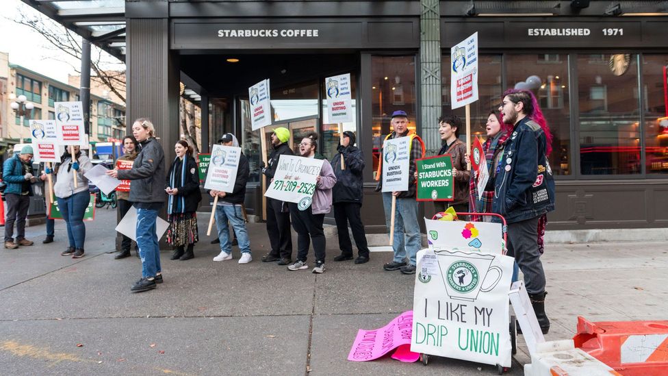Strikes rolled across many US states, including Washington, where protestors and allies marched outside the iconic 1st and Pike Starbucks in Seattle (Credit: Alamy)