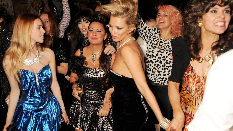 Model Kate Moss and friends dancing in partywear