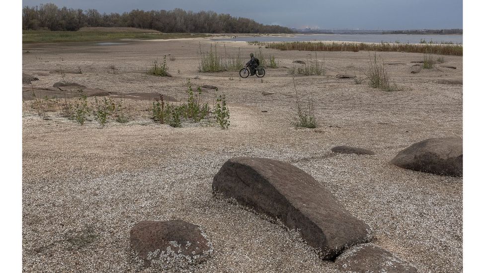Water levels in the Kakhovka Reservoir in Ukraine have fallen drastically after its dam was destroyed, causing widespread ecological damage (Credit: Getty Images)