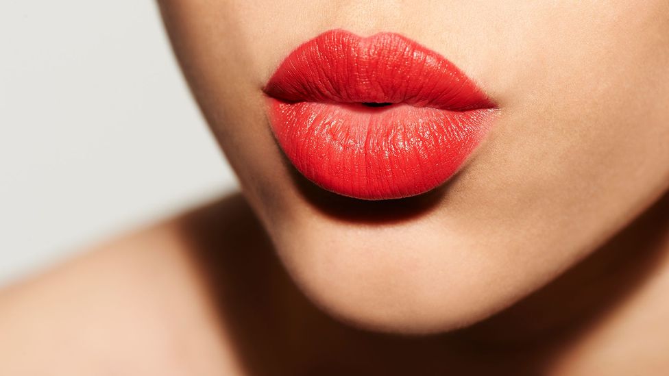 Woman's bright red lips (Credit: Getty Images)