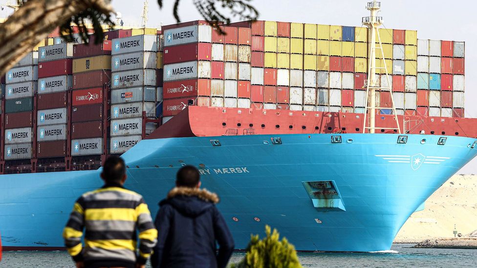 A cargo ship passes through the Suez Canal (Credit: Alamy)