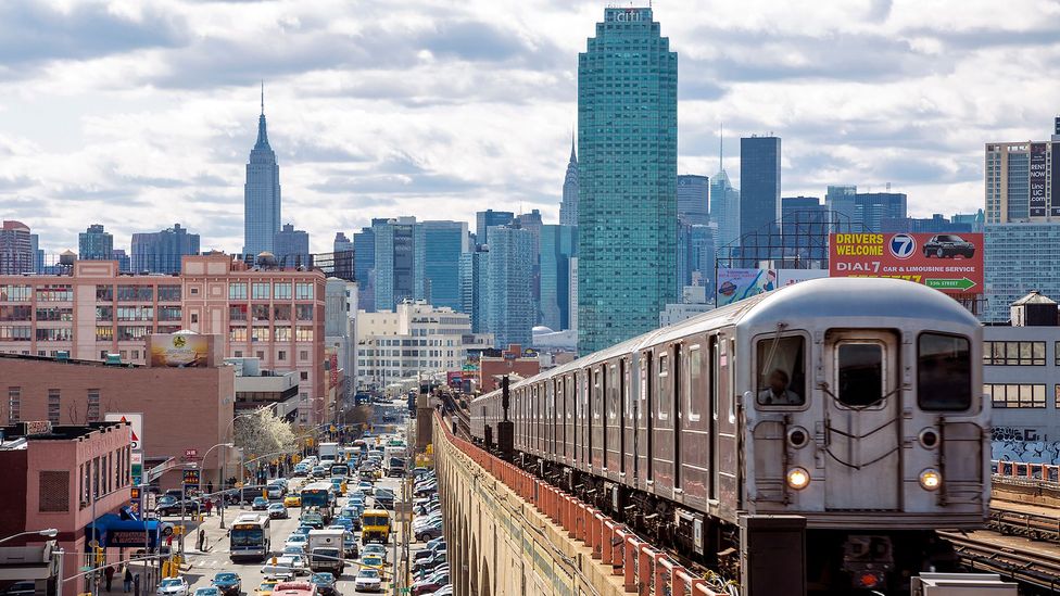 Subway train with New York skyscrapers in background (Credit: Getty Images)