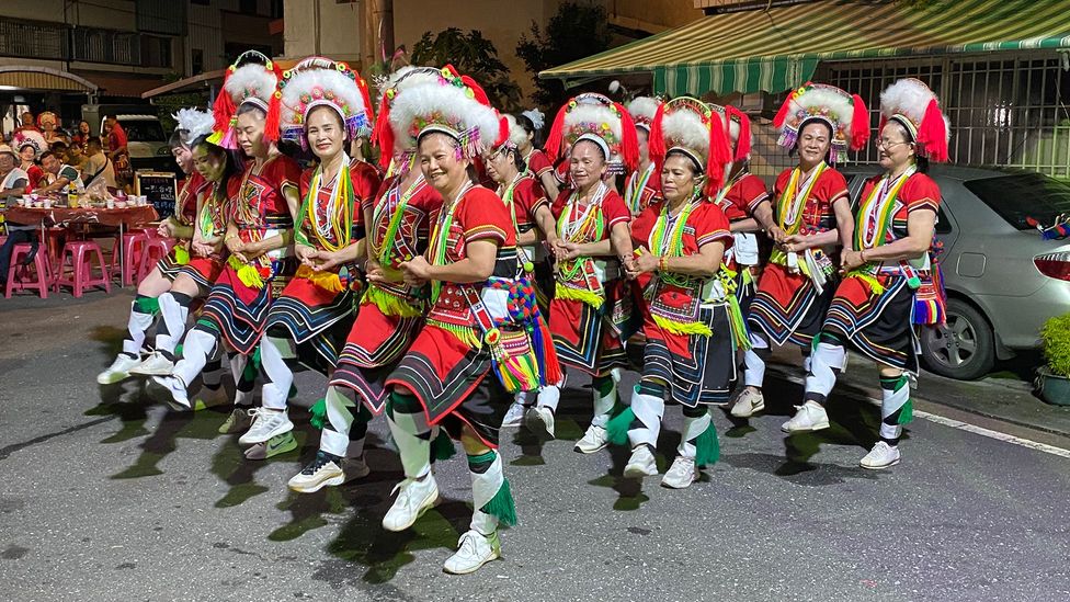 Posko women dressed in their colourful Ilisin costumes
