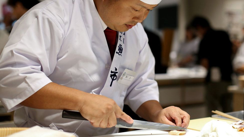 Photo of chef slicing fish