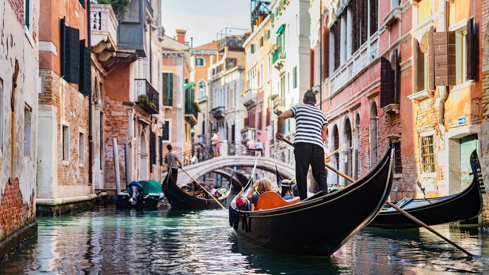 Gondolier in Venice canal