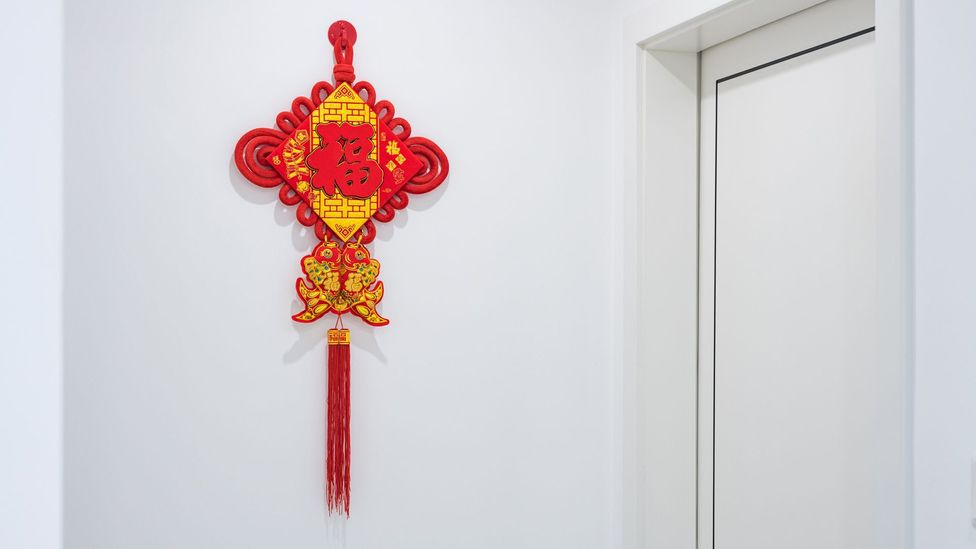 Closeup picture of Chinese knot hanging on the wall