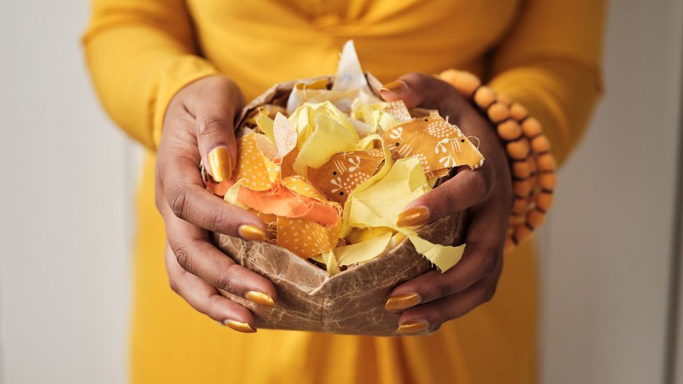 A crafter holds a collection of crafting materials