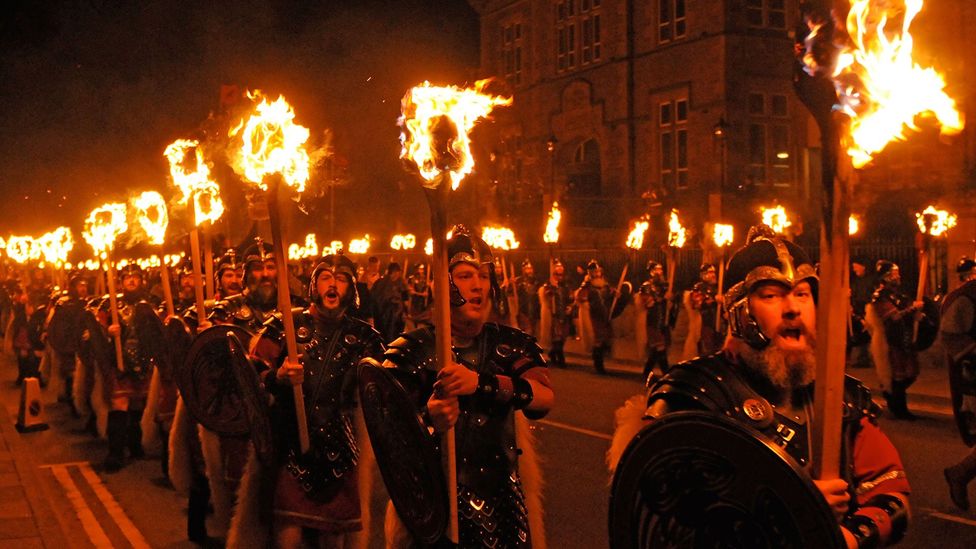 Procession of men dressed as Vikings at Up Helly Aa Fire Festival, Shetland