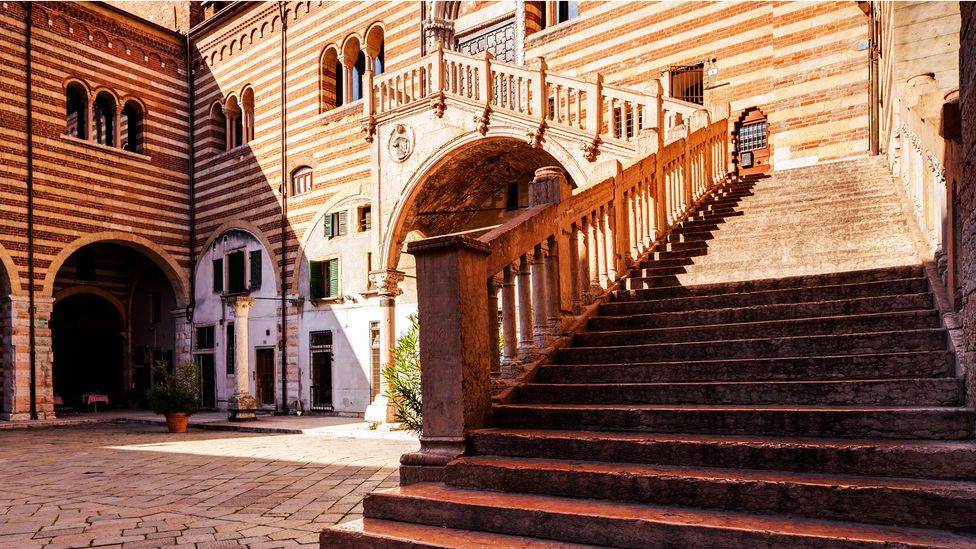 The Palazzo della Ragione is home to a stunning staircase just perfect for taking romantic, memorable photos (Credit: Julian Elliott Photography/Getty Images)
