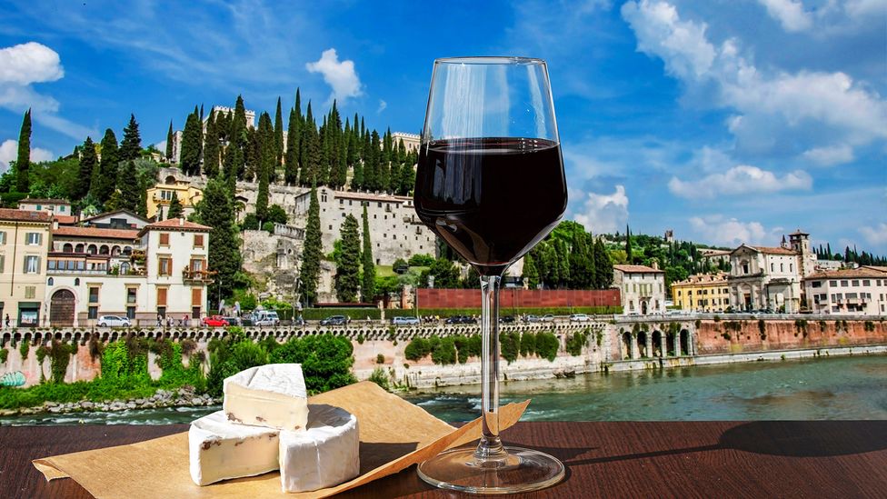 A stroll along Verona's beautiful River Adige reveals beautiful views of the city's monuments and vibrant nightlife (Maria Vonotna/Alamy Stock Photo)
