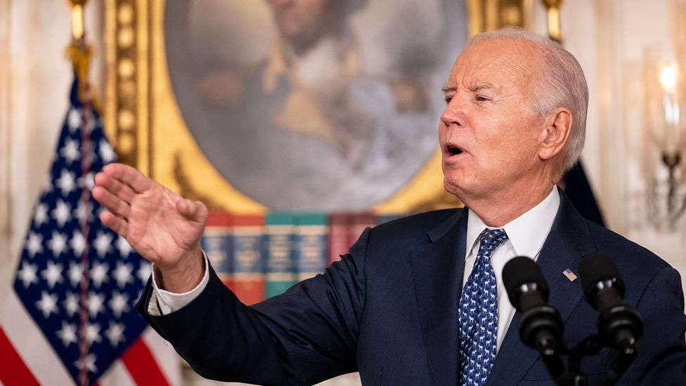 US President Joe Biden signals with his hand while speaking at the White House (Credit: Getty Images)