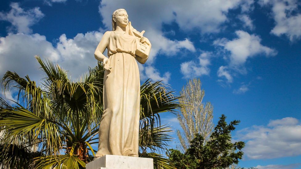 A statue of Sappho stands in the village of Mytilene in Lesbos (Credit: Alamy)