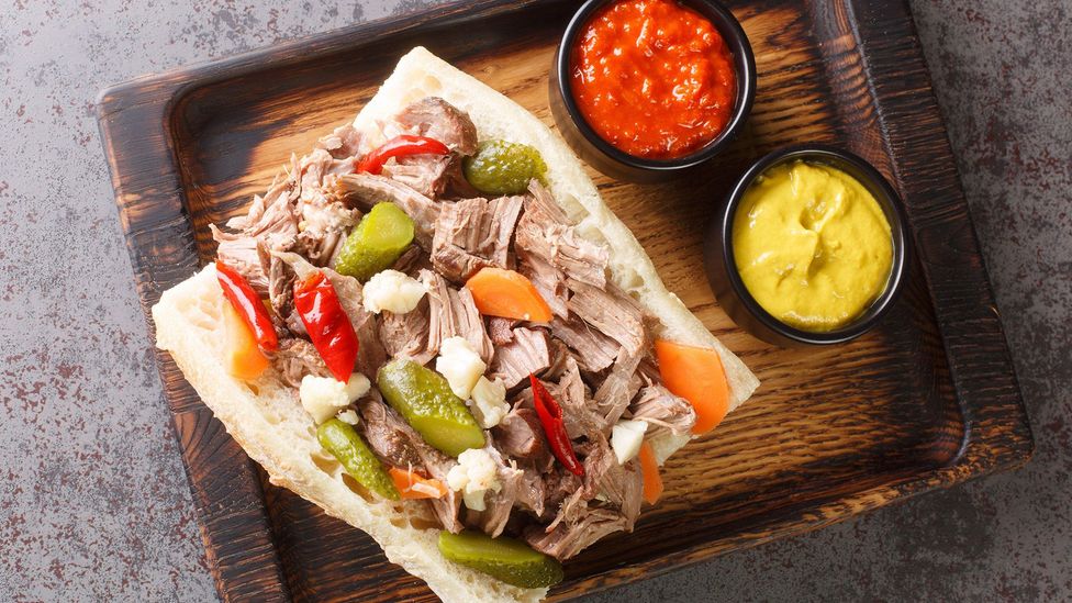 Chicago Italian beef sandwich on a wooden tray Chicago Italian beef sandwich on a wooden tray