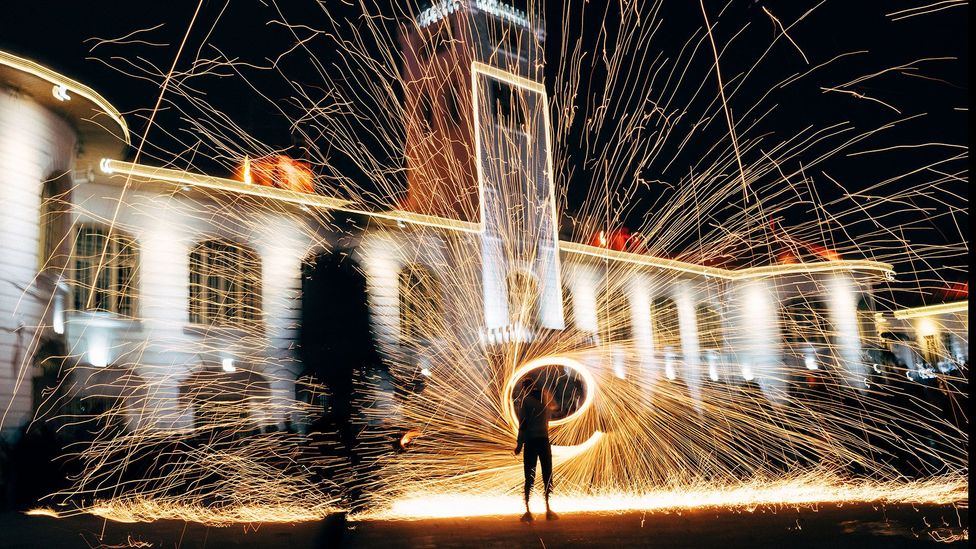A young Iranian boy is spinning fireworks as part of Chaharshanbe Suri, Nowruz